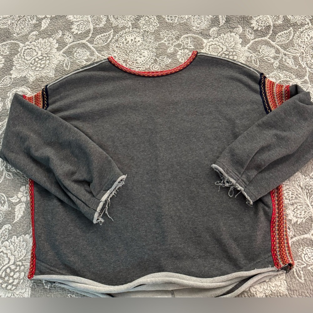 Natural Life sweatshirt with frayed edges and crochet detail.